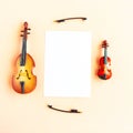 Toy double bass, violin and white mockup blank on pink background, top view Royalty Free Stock Photo