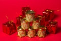 Toy drums gold color on red background. Christmas decorations on a red background. Christmas decorations. Royalty Free Stock Photo