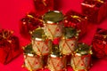 Toy drums gold color on red background. Christmas decorations on a red background. Christmas decorations. Royalty Free Stock Photo