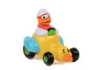 Toy duck driving duck-car on white background Royalty Free Stock Photo