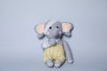 Toy elephant with bandages on light grey background Royalty Free Stock Photo