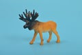 Toy Elk isolated on a blue background Royalty Free Stock Photo