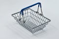 Toy empty shopping basket on white background Royalty Free Stock Photo