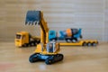 Toy excavator with raised bucket. Royalty Free Stock Photo