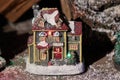 Toy fabulous Christmas house. Christmas composition on a dark background