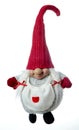 A toy fairy gnome in a long cap. on white background