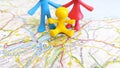 A toy family standing by Edinburgh on a map of Scotland