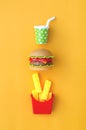 Toy fastfood food and drink on an orange background