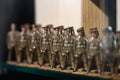 Toy figures of British army soldiers marching in formation on display in museum