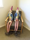 Toy figures sitting on chair