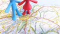 A toy figures standing over Edinburgh on a map of Scotland Royalty Free Stock Photo