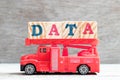 Toy Fire Ladder Truck Hold Block In Word Data On Wood Background