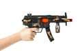 A toy firearm in a child& x27;s hand. Automatic toy weapon. Automatic gun plastic.