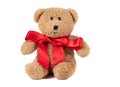 Toy fluffy vintage bear with a red bow on a white background Royalty Free Stock Photo