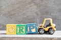 Toy forklift hold block P to complete word CRP abbreviation of C-Reactive Protein Test on wood background Royalty Free Stock Photo