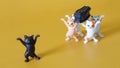 Toy funeral procession of five funny dancing kittens carrying a black coffin. Call for self-isolation and vaccination during the