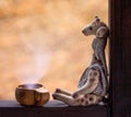 Toy giraffe with a cup of cocoa Royalty Free Stock Photo