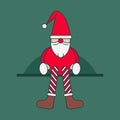 A toy gnome or elf of Santa Claus with long legs sits on a shelf. Bright New Year's character. Christmas holiday Royalty Free Stock Photo