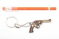 Toy gun with key chain and pen Royalty Free Stock Photo