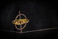 Toy gyroscope balancing on a line Royalty Free Stock Photo