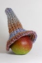 Toy head made of pear and self-made violet cup