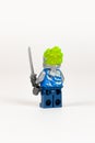 Toy hero Jay in a blue kimono with a sword from a set of lego ninjago on a white background. close-up Royalty Free Stock Photo