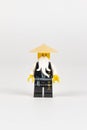 Toy hero Master Wu in a black kimono and a straw hat from a set of Lego ninjago on a white background. close-up.