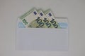 Toy house. banknotes in a yellow envelope on a light background. envelope with banknotes. close-up of an envelope with