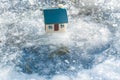 Toy house on ice Royalty Free Stock Photo