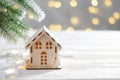 Toy house and christmas tree, abstract light white natural holiday background with copy space Royalty Free Stock Photo