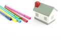 Toy house with felt pens isolated on white