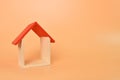 Toy house isolated on orange background with copy space Royalty Free Stock Photo