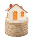 Toy house on stack of euro coins Royalty Free Stock Photo