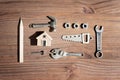Toy House and Tiny Steel Hand Tools and Fasteners Flat-Lay