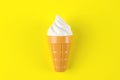Toy ice cream on yellow background. Concept of harmful artificial food. Fast food