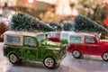 Toy jeeps with Christmas trees on roof, photographed at VV Rouleaux haberdashery shop, Marylebone Lane, London, UK. Royalty Free Stock Photo