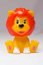 Toy lion sits