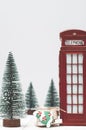 Toy London red phone booth, gifts and christmas trees Royalty Free Stock Photo