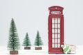 Toy London red phone booth, gifts and christmas trees Royalty Free Stock Photo