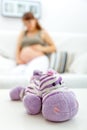 Toy lying on table and pregnant woman in backgroun Royalty Free Stock Photo