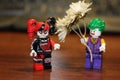 toy man boy gives flowers to girl toy in the style of LEGO