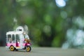 Toy miniature tuk-tuk or tricycle in Thailand. Travel in Thailand Royalty Free Stock Photo