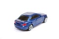 Toy model of the blue BMW 135 car of series of coupe on white background. Royalty Free Stock Photo
