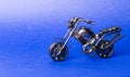 Toy model of a sports motorcycle on a blue background Royalty Free Stock Photo