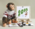 Toy monkey - painter Royalty Free Stock Photo