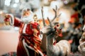 Toy New Year`s decor and decorations for the home. santa with a lantern in his hands. macro photo. holiday christmas and happy new