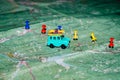 Toy old car rides on a topographic map, the route indicated by the pushpin Royalty Free Stock Photo