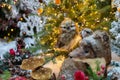 A toy owl sits on a Christmas tree. The concept of the new year. Out of focus foreground.