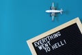 Toy passenger plane next to a felt board that says everything went to hell. The concept of depression, fatigue, disappointment and