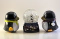 Toy Penguins Looking At Snow Globe Royalty Free Stock Photo